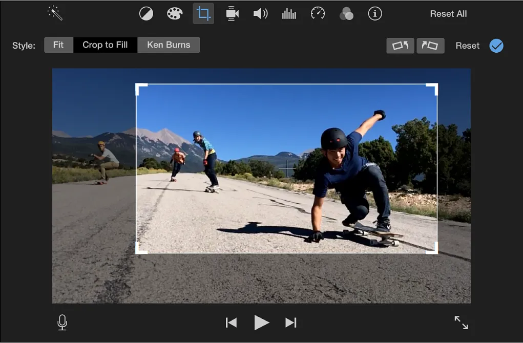 iMovie cropping controls with Crop to Fill selected and a white adjustable crop frame over the video preview